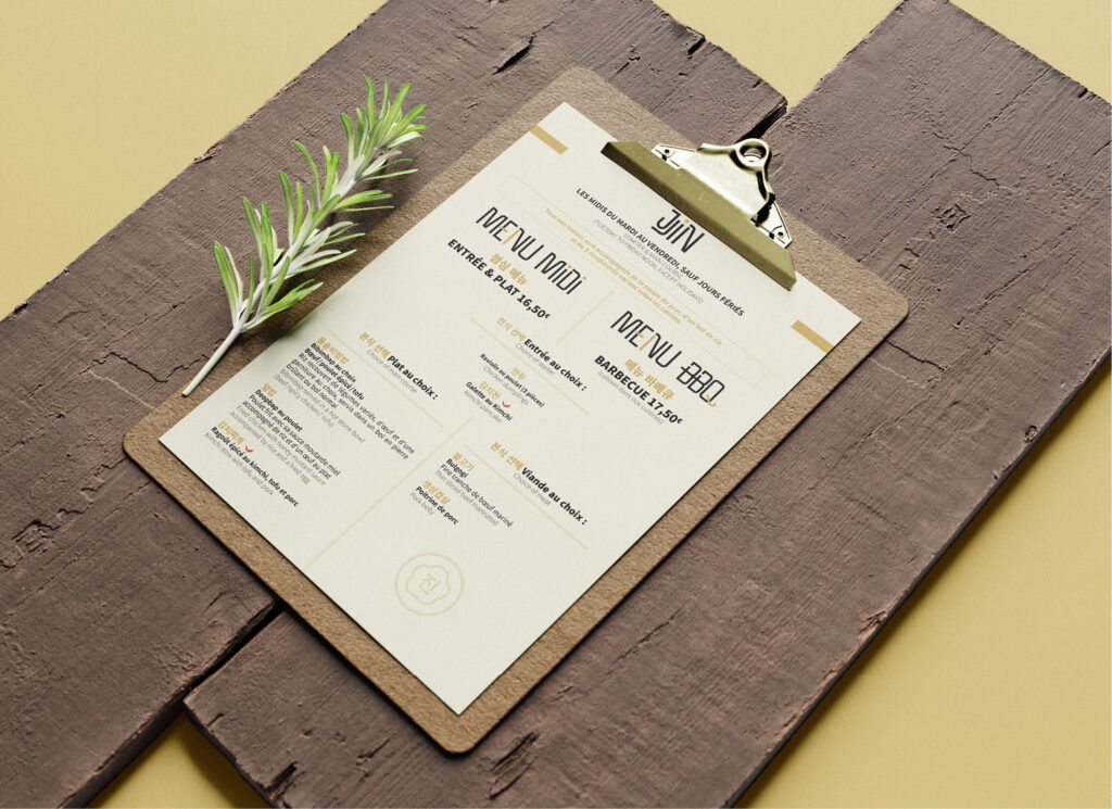 Menu midi du restaurant JJIN présenté sur une planche de bois